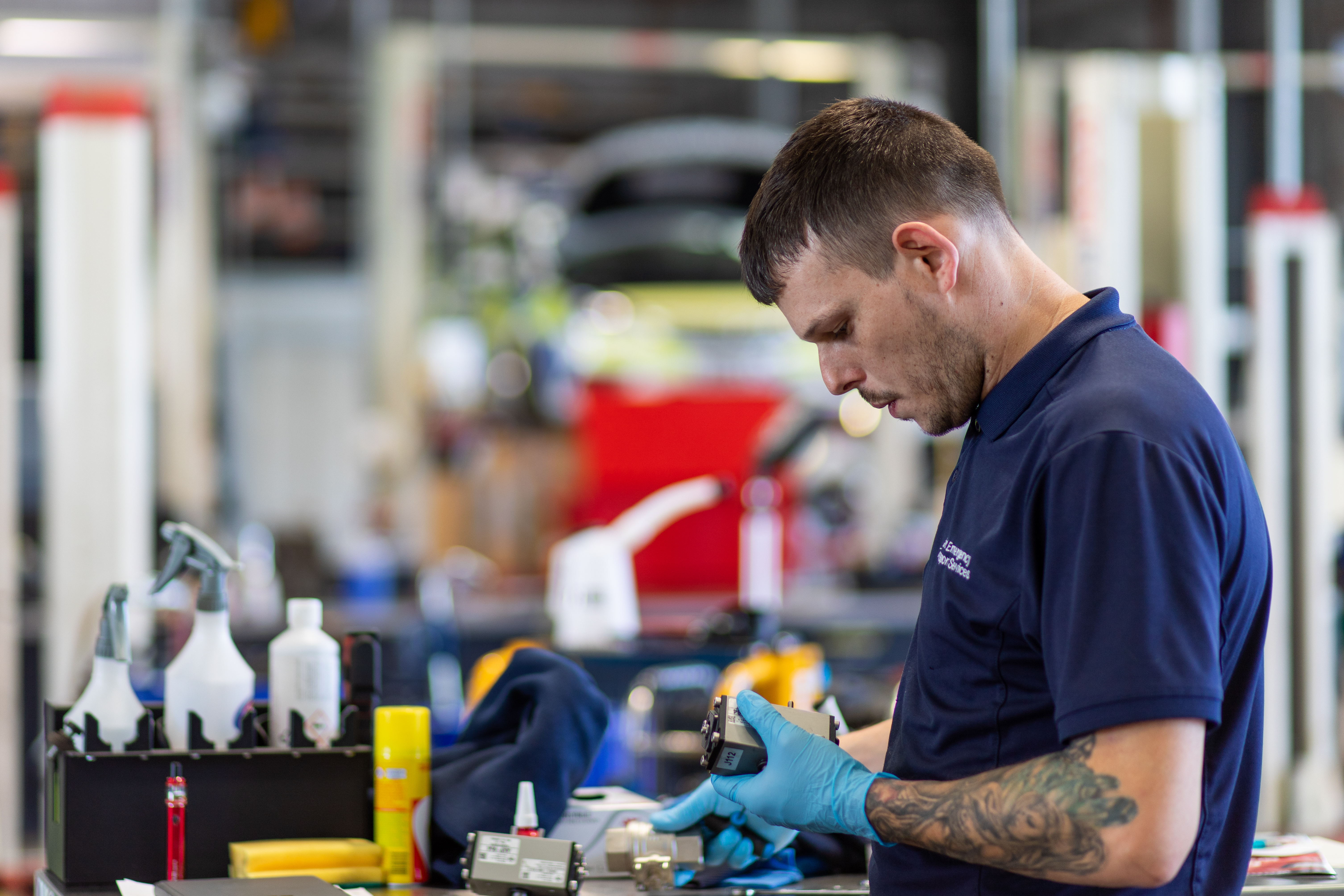 Mechanic fixing a car image