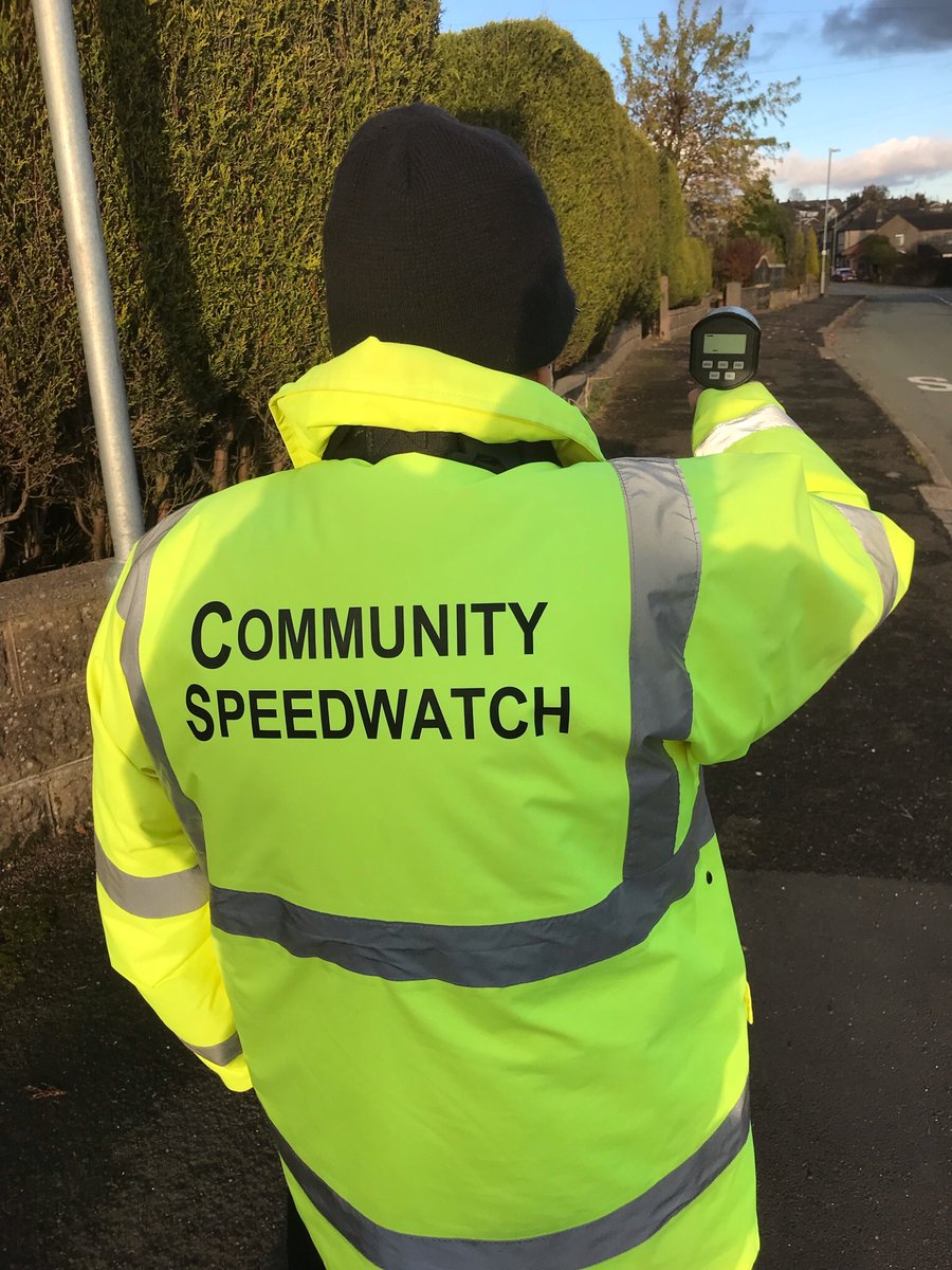 Community speedwatch volunteer monitoring traffic