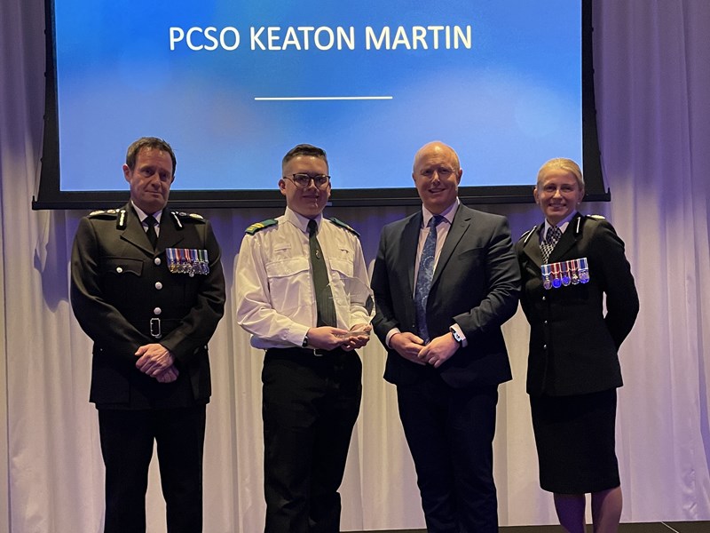 Chief Constable, Chris Noble stood with ACC Becky Riggs and award winner Keaton Martin at the 2024 Force Awards where Keaton is accepting his Volunteer of the Year award